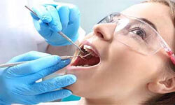 Picture of a dental patient with a dentist illustrating a holistic detox treatment.