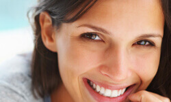 Close-up picture of a woman showing the results of a Maxillofacial surgery.