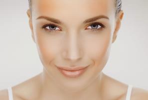 Close-up portrait picture of a beautiful woman’s face, showing the chemical peel procedure she had in Costa Rica.