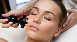 Close-up picture of woman lying on a treatment table having a laser skin procedure depicting the laser skin resurfacing treatment she had in Costa Rica.