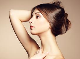 Profile close-up picture of a woman’s face showing the neck and chin liposuction procedure she had in Costa Rica.