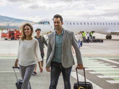 Picture of a man and woman arriving at the airport for their medical vacation in beautiful Costa Rica.