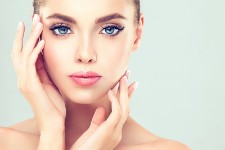 Portrait picture of a woman showing the results of her facial fillers procedure she had in Costa Rica.