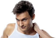 Close-up picture of a man, smiling about his hair transplant procedure he had in Costa Rica