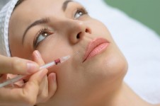 A close-up picture of a woman depicting a microsurgery procedure she had in Costa Rica.