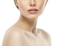 A close-up photo of a woman happy with her neck sculpting procedure she had in Costa Rica.