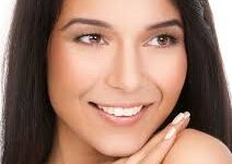 Close-up picture of a woman’s face showing her age spots removal procedure.