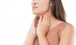 Picture of a woman holding both hands to her jaw showing the area of the holistic jaw osteonecrosis treatment she had.